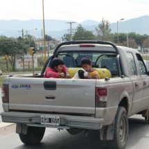 Not a recommended car seat for children - Note the large gas bottle behind them